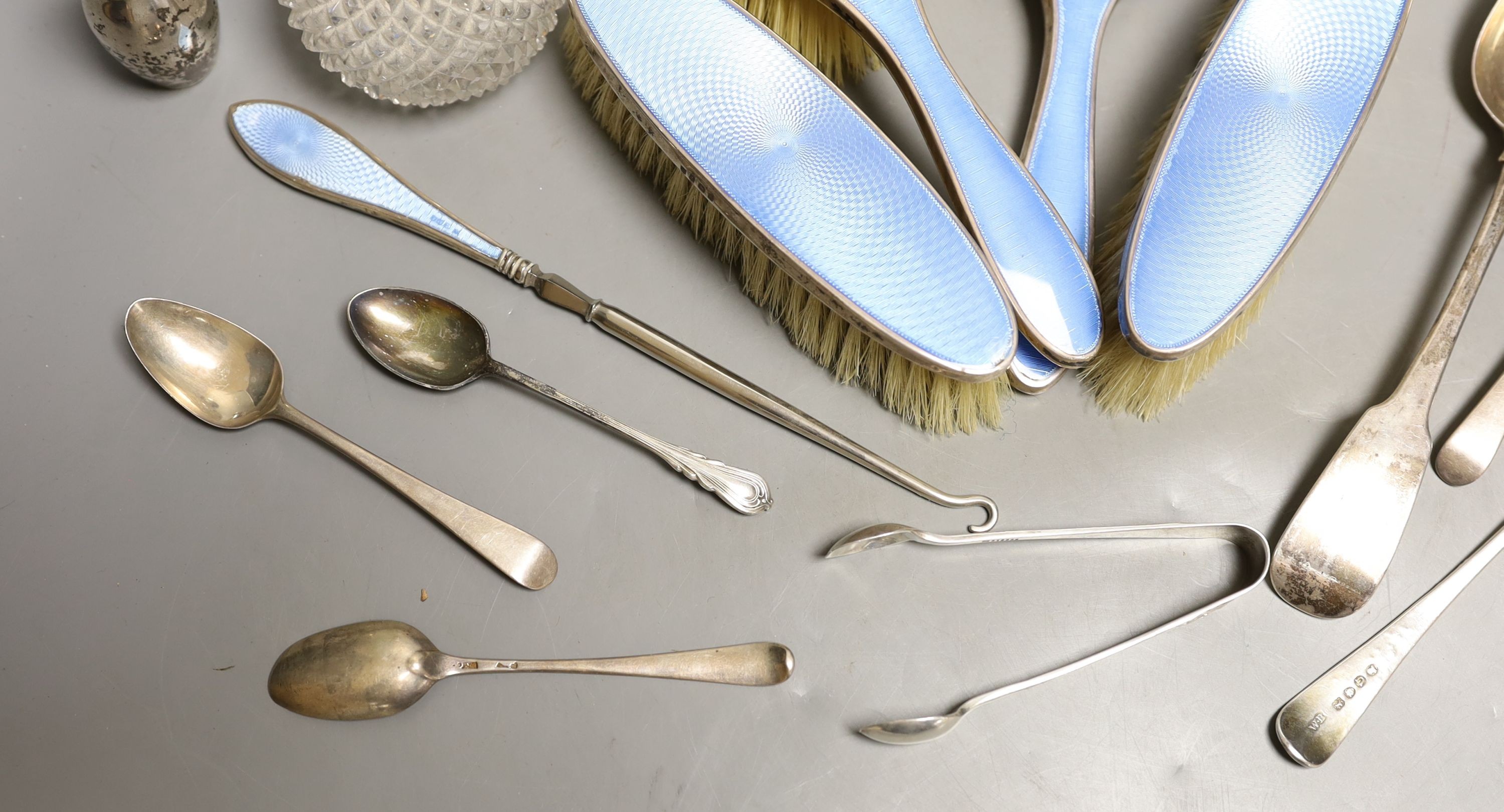 Two silver mounted glass scent bottles, a miniature Scottish silver vase, a five piece silver and guilloche enamelled dressing table set and a small group of assorted silver and sterling flatware